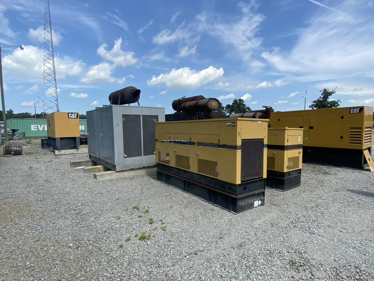 Yard of used Caterpillar diesel generator sets purchased for resale